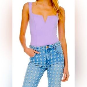Purchased from Bloomingdale’s New with Tags purple bodysuit, size M